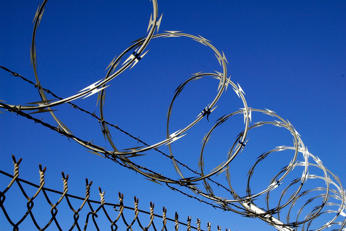 A Man Makes a Dish with Iron Barbed Wire